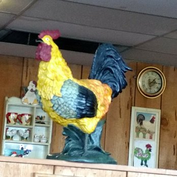 Rooster's - One of the colorful roosters watching over the guests. - American Near Me - Medford, Oregon Rooster's - One of the colorful roosters watching over the guests. - American Near Me - Medford, Oregon