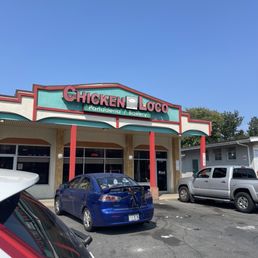 The front of the building, trashy parking lot simple.