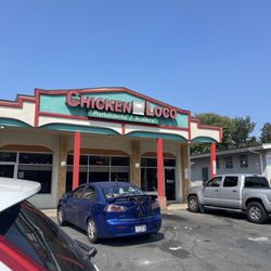 Chicken Loco - The front of the building, trashy parking lot simple.