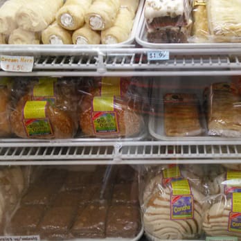 Copina Donuts - a display case filled with various types of donuts - Donuts Near Me - Riverside, California