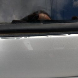 Extreme Twist Collision - Entire windshield area failing after one year.  Water is under the paint and paint is just falling off.