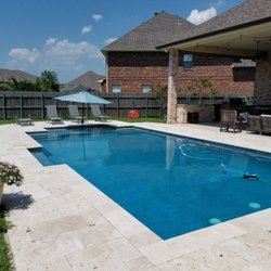 Pontchartrain Pool & Spa - 16'x32' rectangular pool with dyed Blue plaster, Travertine pavers, deck jets, 2 sets of steps with a big play ledge for the kids.