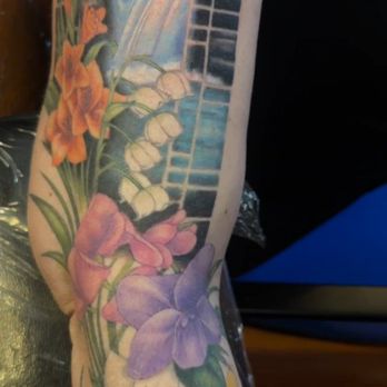 Juniper Tattoo - Tattoo of Cedar Falls behind a Chinese style frame and pet memorial flowers - Tattoo Near Me - Columbus, Ohio Juniper Tattoo - Tattoo of Cedar Falls behind a Chinese style frame and pet memorial flowers - Tattoo Near Me - Columbus, Ohio