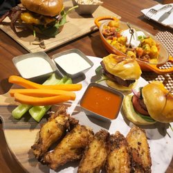 H BAR - All American Burger. Pick 3 for $15: Wings with buffalo on the side, kielbasa sliders (fries that come with it still on the way), tots.