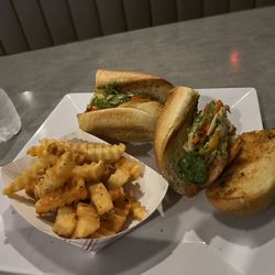Summer Shrimp Po Boy with well seasoned fries.