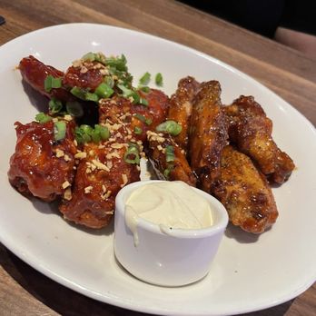 Yard House - Wings 2 sauces Korean Chili Garlic and Whiskey Black Peppee - New American Near Me - Virginia Beach, Virginia Yard House - Wings 2 sauces Korean Chili Garlic and Whiskey Black Peppee - New American Near Me - Virginia Beach, Virginia