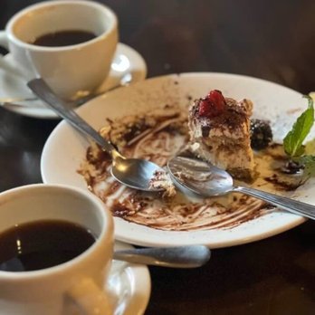 Biancoverde at Hotel Mac - Half eaten Tiramisu. It was delicious and a great way to finish our meal. Coffee was way too hot. - Italian Near Me - Richmond, California Biancoverde at Hotel Mac - Half eaten Tiramisu. It was delicious and a great way to finish our meal. Coffee was way too hot. - Italian Near Me - Richmond, California