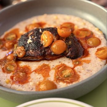 Burdell - BLACKENED BLACK COD Creamy Brentwood sweet corn grits, Sungold tomato vinoigrette - Soul Food Near Me - Oakland, California