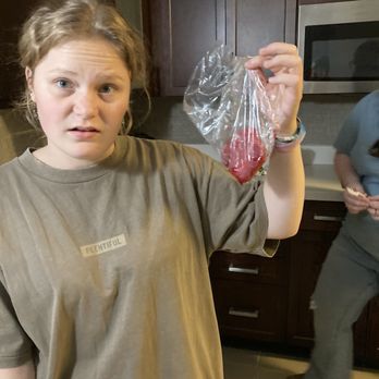 Pho Real Kitchen & Bar - Me holding the bloody sack of meat - Asian Fusion Near Me - Des Moines, Iowa