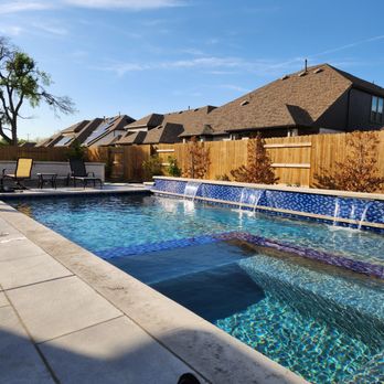 Cody Pools - Georgetown - a pool in the backyard - General Contractors Near Me - Georgetown, Texas