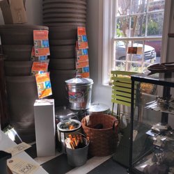 PW SHORT General Store - Gardening supplies, display case on right has sterling silver serving, flatware, flask
