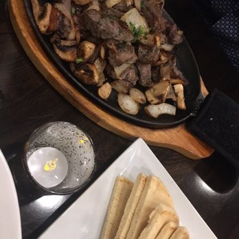 Hapy Bistro - Steak bites and button mushrooms (comes with a plate of pita bread) - Mediterranean Near Me - Pismo Beach, California Hapy Bistro - Steak bites and button mushrooms (comes with a plate of pita bread) - Mediterranean Near Me - Pismo Beach, California