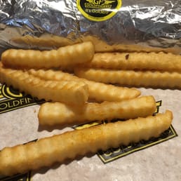 a bunch of french fries on a table a bunch of french fries on a table