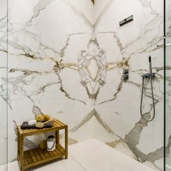 Calacatta Gold Borghini Extra marble quadmatched shower vignette.