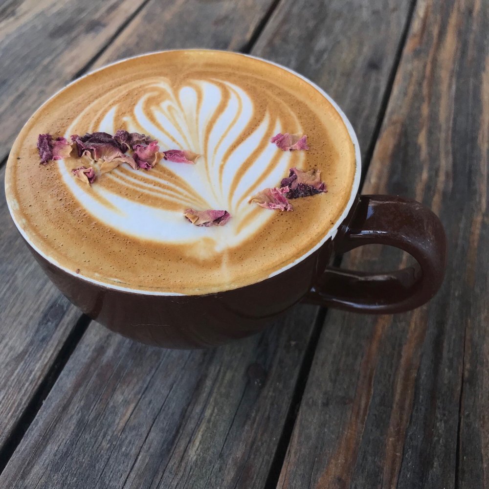 Cocoa Cinnamon - Xochiquetzal Latte (rose infused honey latte with lavender and rose petals) - Coffee & Tea Near Me - Durham, North Carolina Cocoa Cinnamon - Xochiquetzal Latte (rose infused honey latte with lavender and rose petals) - Coffee & Tea Near Me - Durham, North Carolina