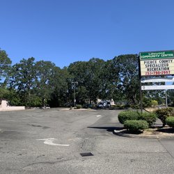 Lakewood Community Center - Parking lot and sign by the road.