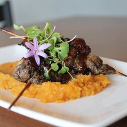Sip Cafe - Marinated jerk chicken skewer on sweet potatos.