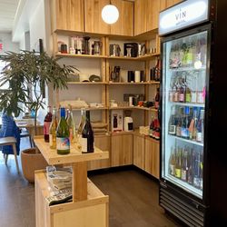 Café Hubert Saint Jean - The wine store/selection area behind the ordering counter / April 2024