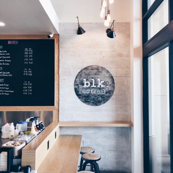 Blk Dot Coffee - Interior photo of bar seating with power outlets for laptops/phones. - Coffee & Tea Near Me - Irvine, California Blk Dot Coffee - Interior photo of bar seating with power outlets for laptops/phones. - Coffee & Tea Near Me - Irvine, California
