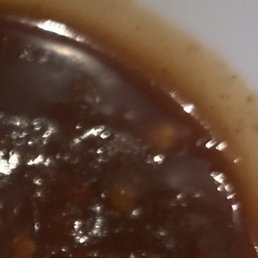 a bowl of stew with a spoon in it