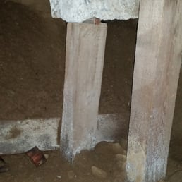 Literally a piece of scrap wood and a rock.