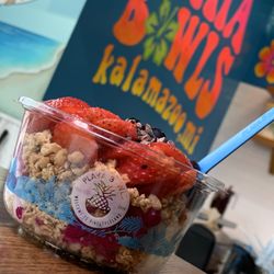 Dragonberry Pitaya Bowl: 1/2 Coconut Base, Strawberries, Blueberries, Sub Vegan Granola, Sub Cacao Nibs for Honey. (Vegan)