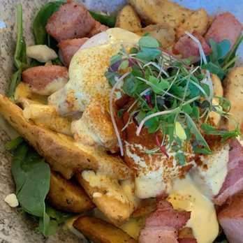 OEB Breakfast - Downtown - Gold digger: half potatoes and half spinach with poached eggs, pork, black truffle and hollandaise sauce - Breakfast & Brunch Near Me - Calgary, Alberta