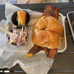 Eggs, cheddar cheese w. Bacon on a croissant