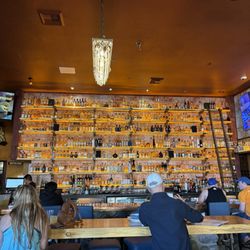 The wall of liquor behind the bar