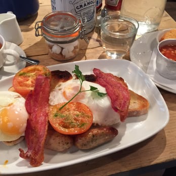 Bill's - My English Breakfast (friend eggs, Coventry sausage, bacon, tomato, mushroom, and toast. Plus baked beans & Crispy Potato - Modern European Near Me - London, XGL Bill's - My English Breakfast (friend eggs, Coventry sausage, bacon, tomato, mushroom, and toast. Plus baked beans & Crispy Potato - Modern European Near Me - London, XGL