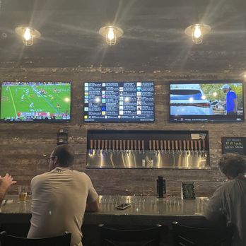 Valley Taproom - people sitting at the bar watching tvs - Beer Bar Near Me - Gilbert, Arizona