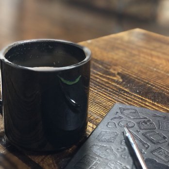 The Coffee Bar - a cup of coffee and a notepad - Coffee & Tea Near Me - Gadsden, Alabama