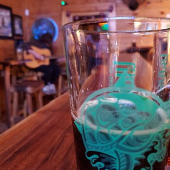 Green River Eddy's Tap Room & Grill - a beer glass with a green dragon on it - Beer Bar Near Me - Saluda, North Carolina Green River Eddy's Tap Room & Grill - a beer glass with a green dragon on it - Beer Bar Near Me - Saluda, North Carolina