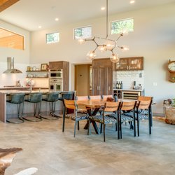 Inner Space Designs - Custom built home features custom items: dining chairs w/ Pendleton fabric & laced leather; island with leathered finished granite.