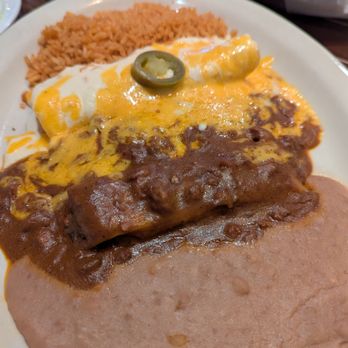 El Vecino - Tamale w/ Chili Con carne,Cheese enchilada w/ Chili Con carne,sour cream chicken enchilada,rice beans Non better - Tex-Mex Near Me - Dallas, Texas