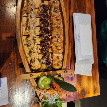 Oceano Sushi - Sushi boat - pure heaven!  This is the Queen Anne roll, Dragon roll and Vela... (spell?!) roll - Sushi Bars Near Me - Bothell, Washington