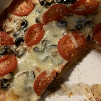 Giovanni's Pizza - a slice of pizza with tomatoes and olives - Pizza Near Me - Chicago, Illinois