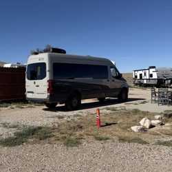 Rawlins KOA Journey - Level RV sites with hookups and a nice seating area