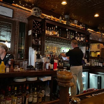 Carsons Tavern - a bartender at the bar - American Near Me - Stuart, Florida Carsons Tavern - a bartender at the bar - American Near Me - Stuart, Florida
