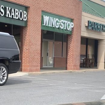 Wingstop - a car parked in front of a wingtop - Chicken Wings Near Me - Ellicott City, Maryland