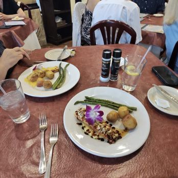 Fernando's Dockside Grille - Our two yummy salmon dishes. - Portuguese Near Me - Port St. Lucie, Florida