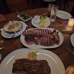 Porterhouse, NY strip, bacon mac n cheese, asparagus, brussel sprouts