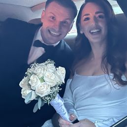 Satisfied Bride in Groom inside the Rolls Royce Phantom