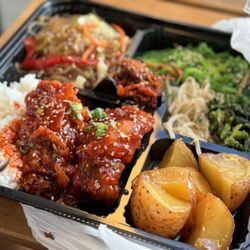YD Togo Korean BBQ - Sweet spicy chicken, braised potatoes, japchae and seaweed salad.