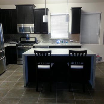 Premier Granite Solutions - Waterfall edge - Building Supplies Near Me - Austin, Texas