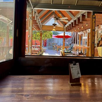 Sophia's Thai Bar & Kitchen - October 8, 2026 - Inside table next to window looking out on patio. - Thai Near Me - Davis, California Sophia's Thai Bar & Kitchen - October 8, 2026 - Inside table next to window looking out on patio. - Thai Near Me - Davis, California