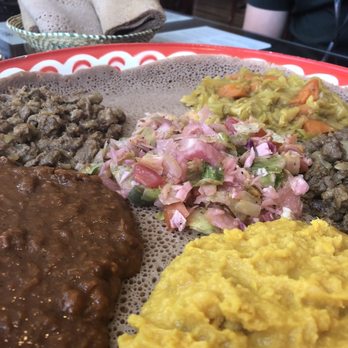 Zagol Ethiopian Restaurant - Meat & veggie gebeta w/ Tikil Gomen, Ye Siga Tibs, Kik Alicha, Key Wat, and Ye Beg Tibs - Ethiopian Near Me - Reno, Nevada Zagol Ethiopian Restaurant - Meat & veggie gebeta w/ Tikil Gomen, Ye Siga Tibs, Kik Alicha, Key Wat, and Ye Beg Tibs - Ethiopian Near Me - Reno, Nevada