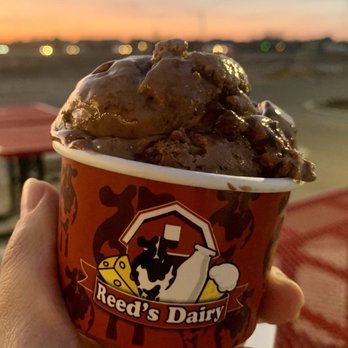 Reeds Dairy - Boise - a hand holding a cup of ice cream - Ice Cream & Frozen Yogurt Near Me - Boise, Idaho Reeds Dairy - Boise - a hand holding a cup of ice cream - Ice Cream & Frozen Yogurt Near Me - Boise, Idaho