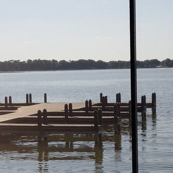 Harborside - Tranquil view as we enjoy an early dinner. Fun to watch the boaters and jet skiiers zipping along the lake. - Seafood Near Me - Winter Haven, Florida