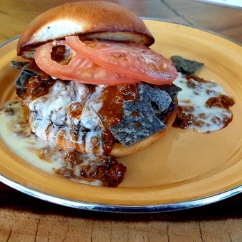 Burgerteca - Burger week special.  Corn tortillas and chili on top of a beef patty. - Burgers Near Me - San Antonio, Texas